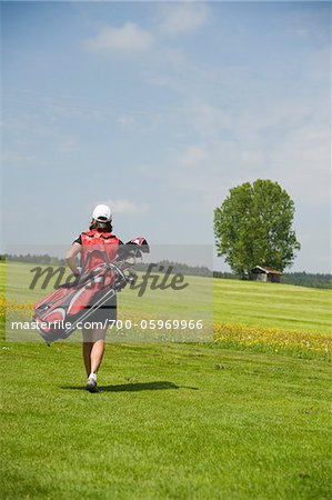 Woman Carrying Golf Bag