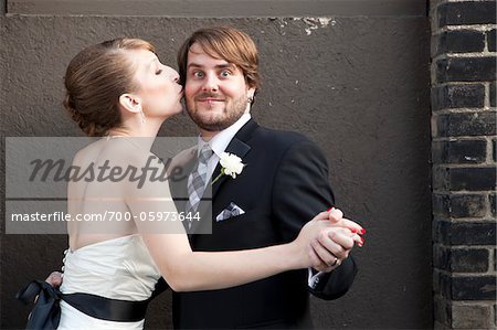 Bride Kissing Groom on Cheek Bride Kissing Groom on Cheek