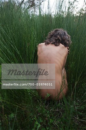 Nude Woman Sitting in Long Grass Nude Woman Sitting in Long Grass