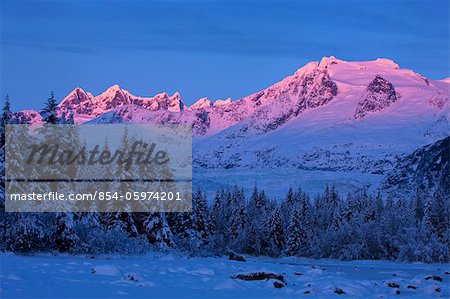 Panoramic view of alpenglow on the Coast Mountains above Mendenhall Glacier, Tongass National Forest, Southeast Alaska, Winter
