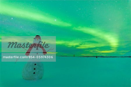 Digitally Altered,Snowman watching Northern Lights, Winter, Eureka Summit, Glenn Highway, Southcentral Alaska,