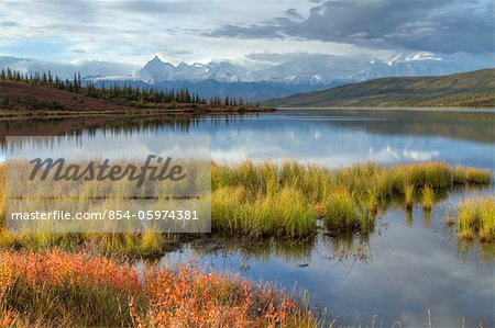 Morning scenic of Wonder Lake with snow covered Mt. Brooks, Mt. McKinley and the Alaska Range in the background, Denali National Park & Preserve, Interior Alaska, Autumn, HDR