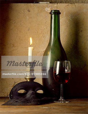 still life - bottle, glass of red wine, candlestick