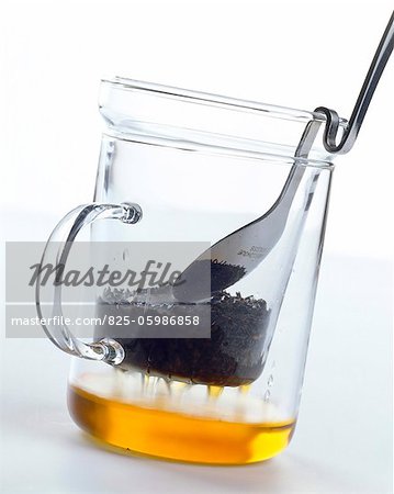 Straining tea in glass mug