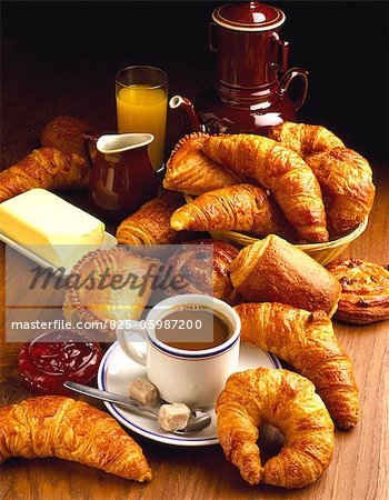 Croissants and pastries with cup of white coffee