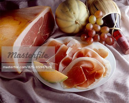 Parma ham, melon, grapes and Italian wine
