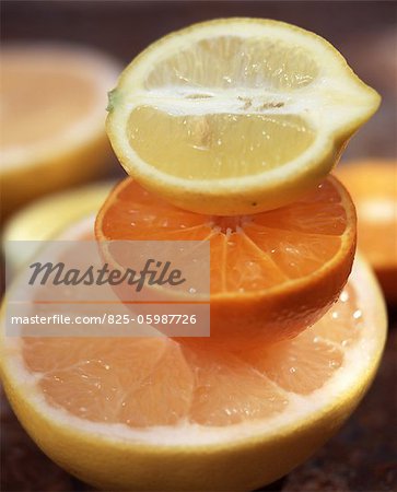 Grapefruit, orange and lemon halves