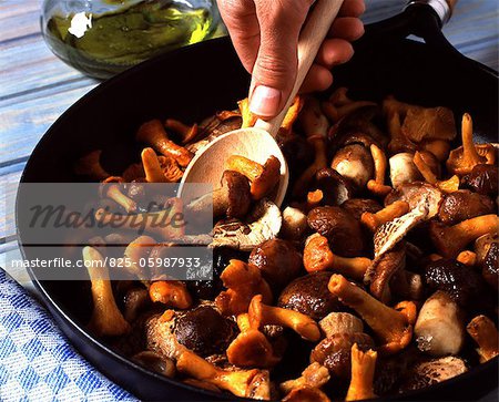 Preparing preserved wild mushrooms in pan