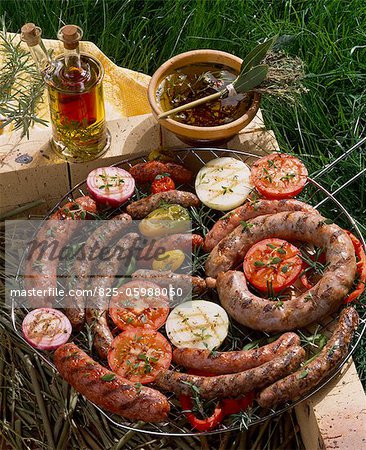 Raw sausages on barbecue