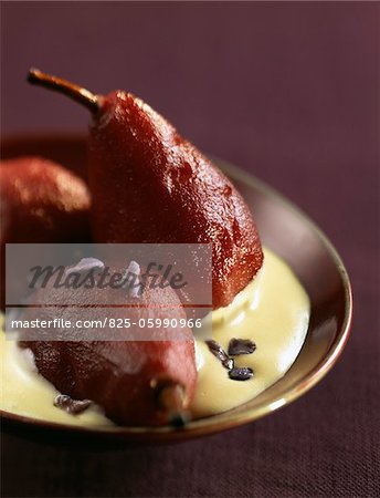 Pears cooked in red wine with violet cream
