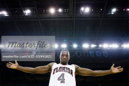 Basketball player with arms out, portrait