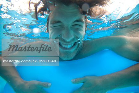 Young man in water, underwater view