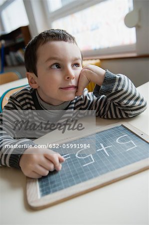 Boy solving math problem