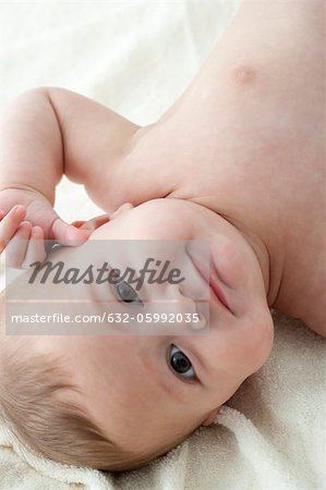 Baby boy lying on back, portrait