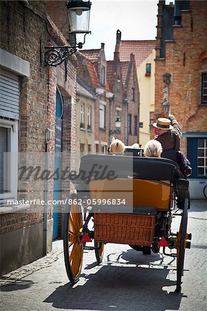 Tours in horse carriages in the center of Bruges, Flanders, Belgium