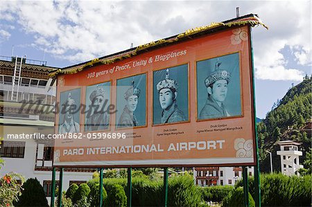 Poster of the five Kings of Bhutan at Paro airport.