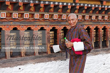 Turning the beautiful black and gold prayer wheels at Changangkha Lhakhang, where parents come to obtain auspicious names for their newborns.