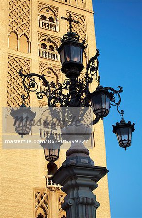 Spain, Andalusia, Seville; A highly ornamented lamp post in the historic centre