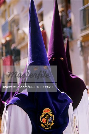 Spain, Andalusia, Seville. Nazarenos during Semana Santa processions