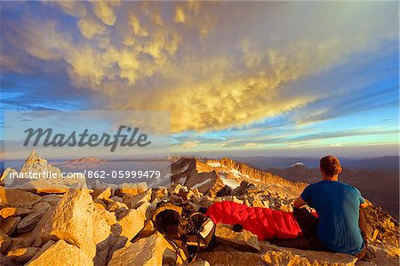 Europe, Spain, Pyrenees, Pico de Aneto  (3404m), highest peak in mainland spain, climber looking at sunrise view