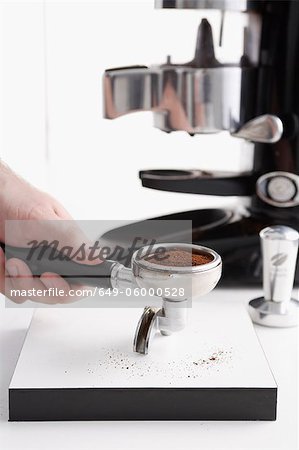 Barista using espresso machine