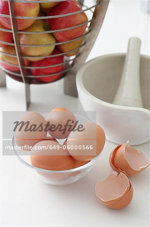 Bowls of eggs and apples