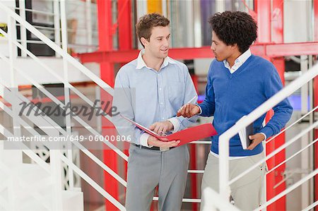 Businessmen talking in office