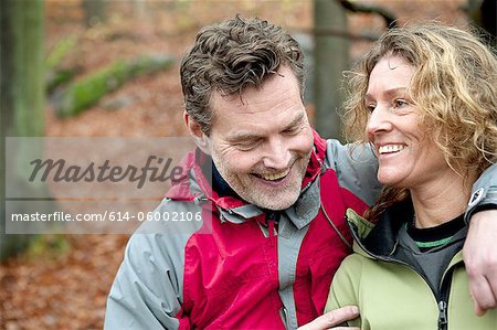 Mature couple smiling in forest