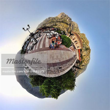 Family on vacation in Kotor, Montenegro, little planet effect