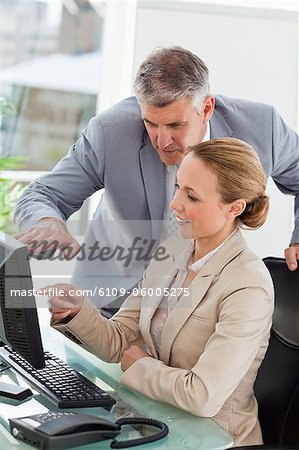 Businesswoman working with her boss in a office