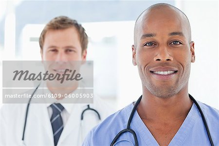 Young male doctors standing in line