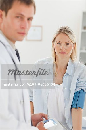 Young woman getting her blood pressure checked