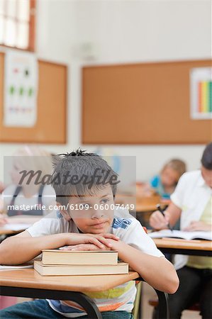 Sad looking elementary student in class