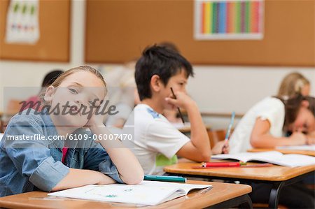 Side view of bored young schoolgirl