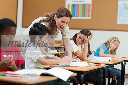 Side view of helpful elementary teacher