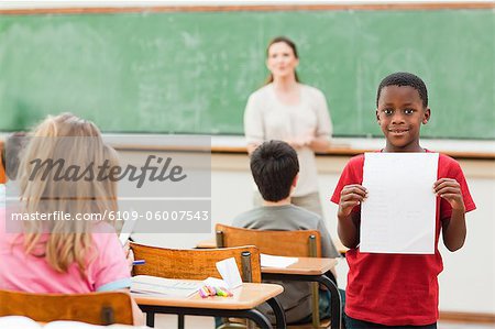 Elementary pupil showing his test results