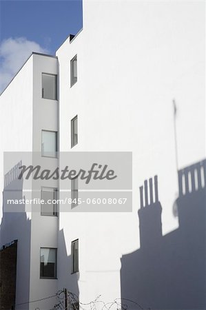 Chimney pot shadows on white building exterior, Northdown Street, Kings Cross, London, UK. Architects: Squire and Partners