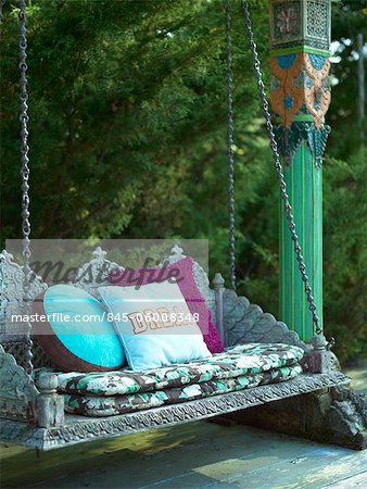 Country House, Pennsylvania. Swing seat with cushions. Designed by Designed by Todd Oldham