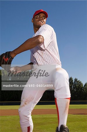 Baseball pitcher throwing ball during game