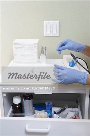 Hygienist preparing hypodermic in surgery