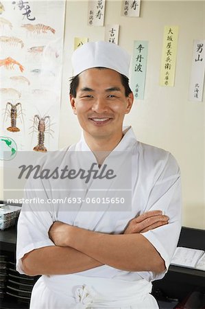 Sushi chef standing in restaurant