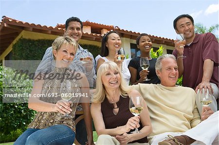 Friends drinking wine outdoors