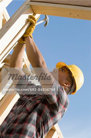 Construction worker checking building