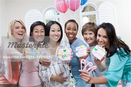 Pregnant Asian Woman with friends at a Baby Shower