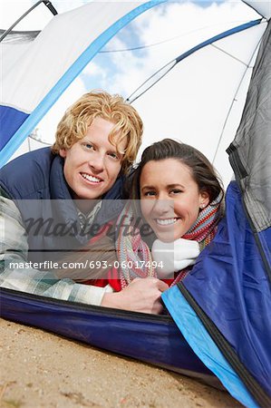 Young Couple Lying Down in Tent.