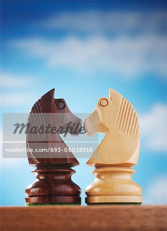 Chess pieces, two knights face to face