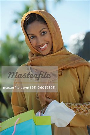 Portrait of muslim woman with shopping bag