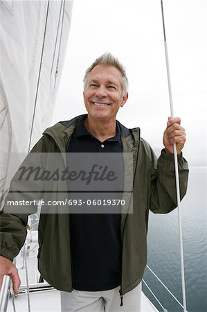 Man standing on yacht, portrait