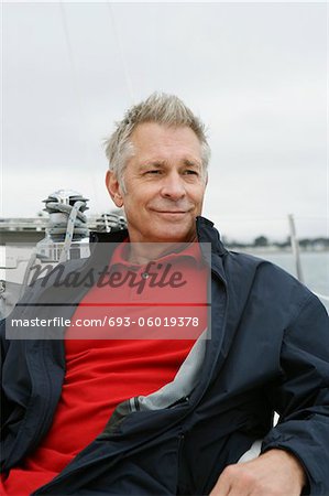 Man relaxing on yacht, portrait