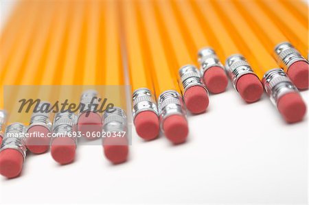 Row of yellow pencils, close-up of erasers